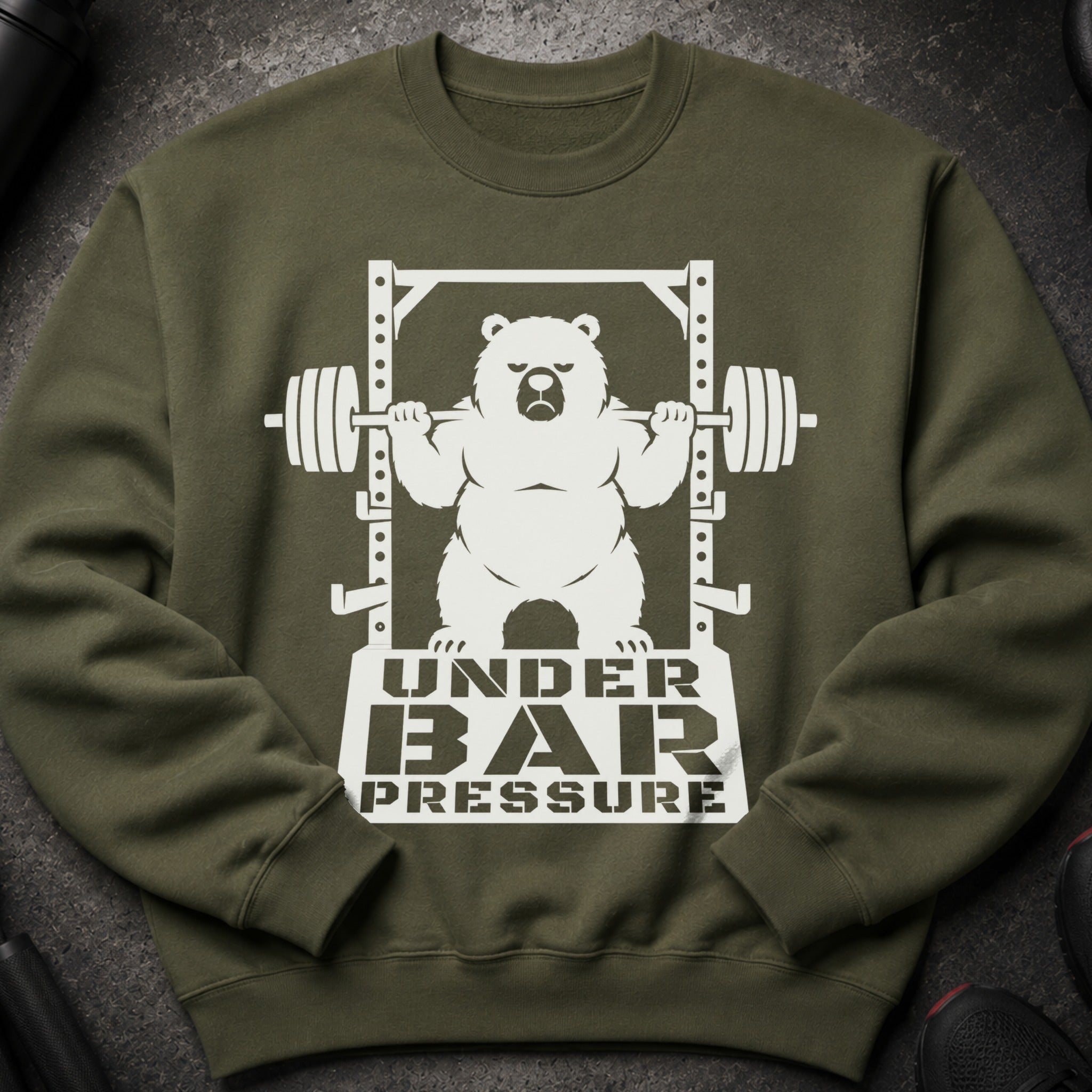 Olive green sweatshirt with white graphic of a bear lifting weights with text "UNDER BAR PRESSURE".