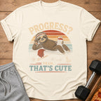 Sloth on bench, holding water bottle, text: Progress? Yeah... That's Cute.