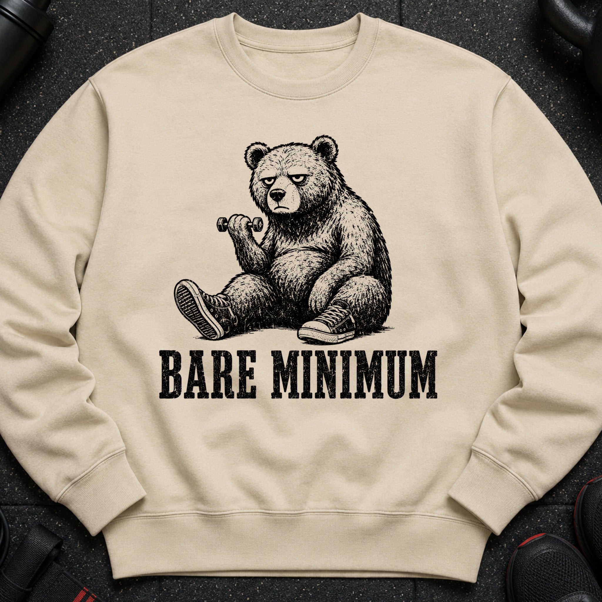 Crewneck sweatshirt with a sketch of a bear lifting a dumbbell and text reading "BARE MINIMUM".