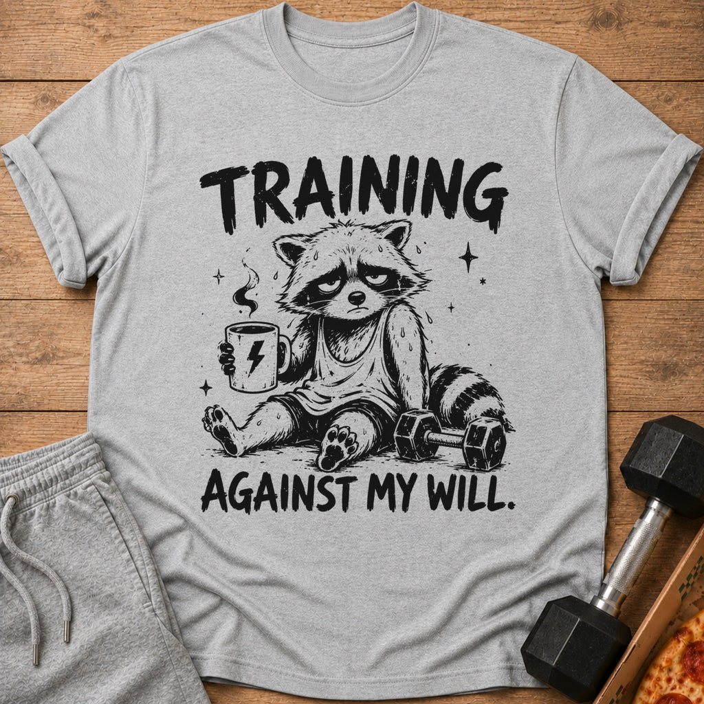 Gray t-shirt with black graphic of raccoon holding coffee, with text "TRAINING AGAINST MY WILL."