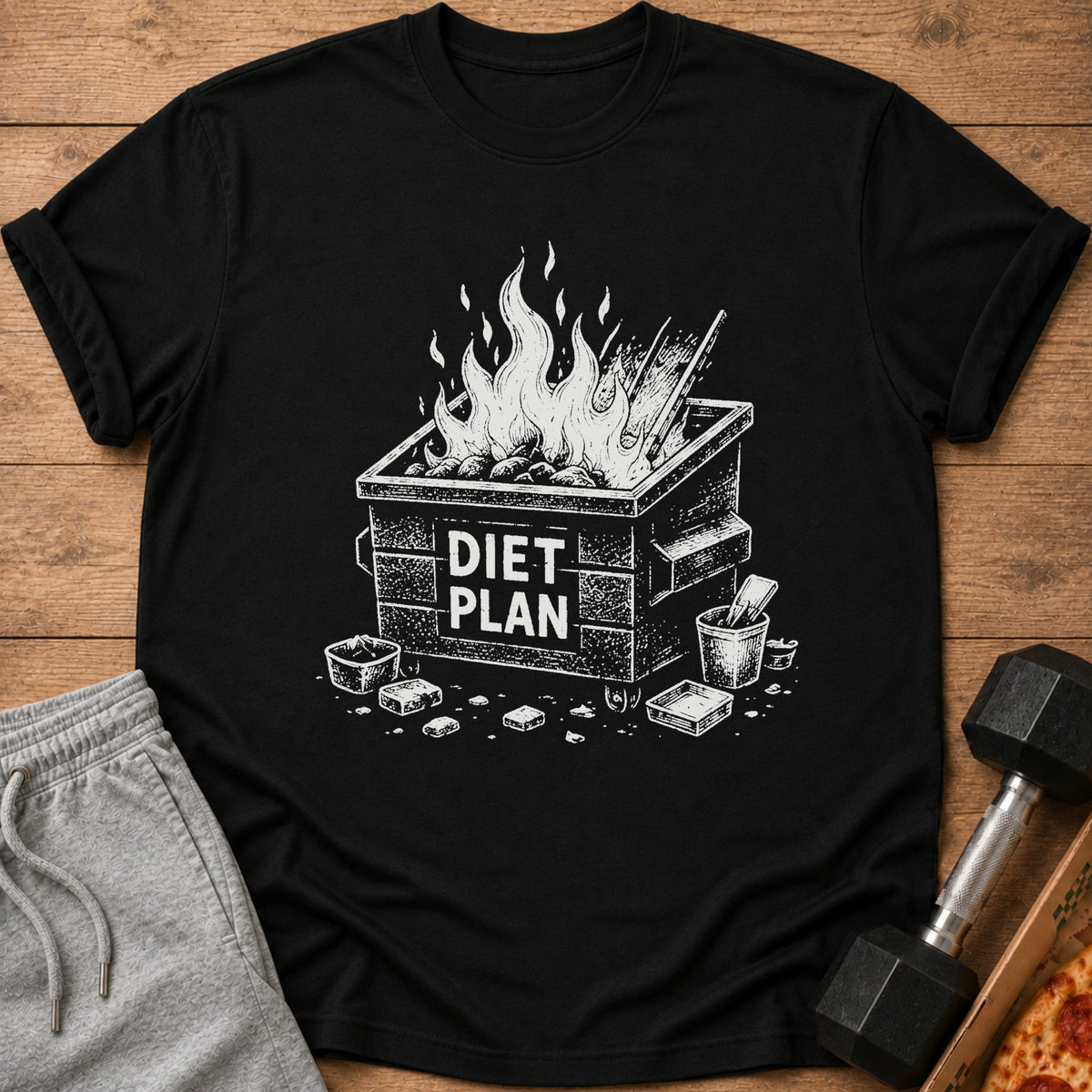 Black t-shirt with a white graphic of a dumpster fire labeled "DIET PLAN".