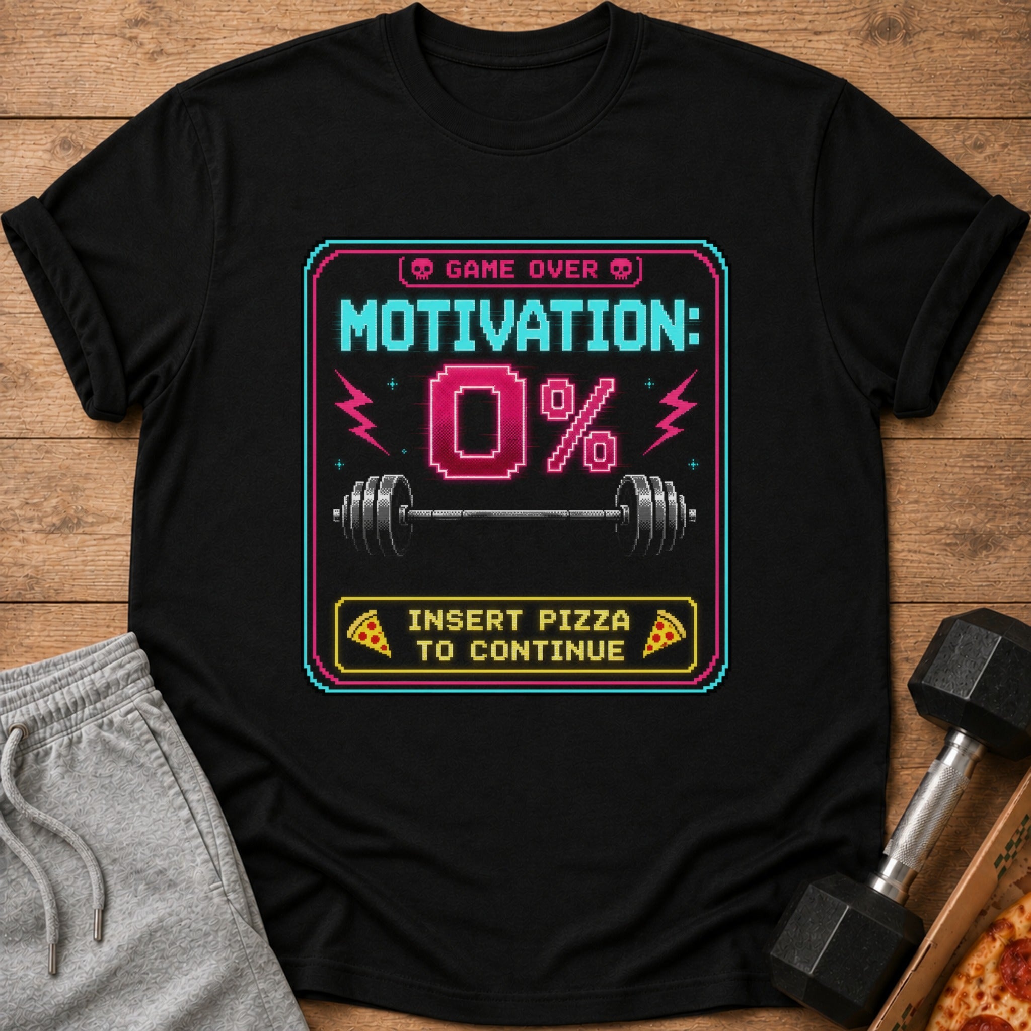 Black t-shirt with pixelated "Game Over Motivation: 0%" and "Insert Pizza to Continue."