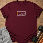 Maroon t-shirt with a white outline graphic of a stick figure sitting inside a low battery icon.