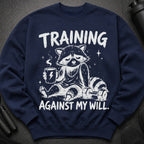 Navy sweatshirt with a raccoon holding coffee and the text "TRAINING AGAINST MY WILL."