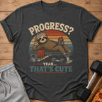 Dark gray t-shirt with a sloth on a weight bench and the text "PROGRESS? YEAH... THAT'S CUTE".