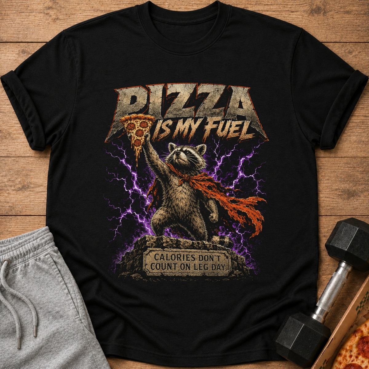 Black t-shirt with raccoon holding pizza, text reads "Pizza is my fuel".