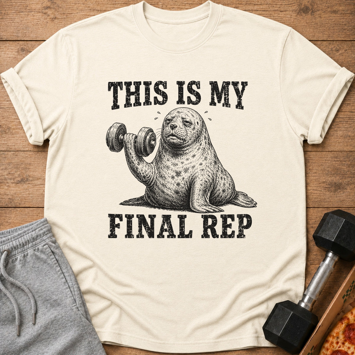 T-shirt with drawing of seal lifting dumbbell and text "THIS IS MY FINAL REP".