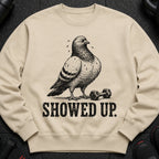 Light beige sweatshirt featuring a pigeon next to dumbbells with sweat drops and the text "SHOWED UP."