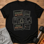 Black t-shirt with "Membership Active" and fitness icons, next to sweatpants and dumbbell.