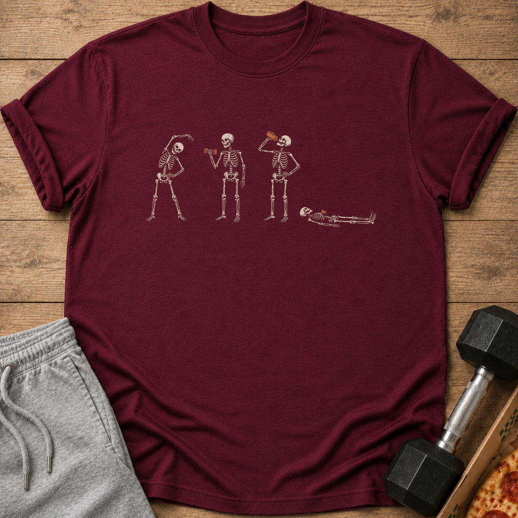 Maroon t-shirt with cream skeleton graphic performing exercises and drinking from a bottle.