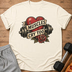 T-shirt with a broken heart graphic featuring dumbbells, rose, and text "Muscles Cry Too."