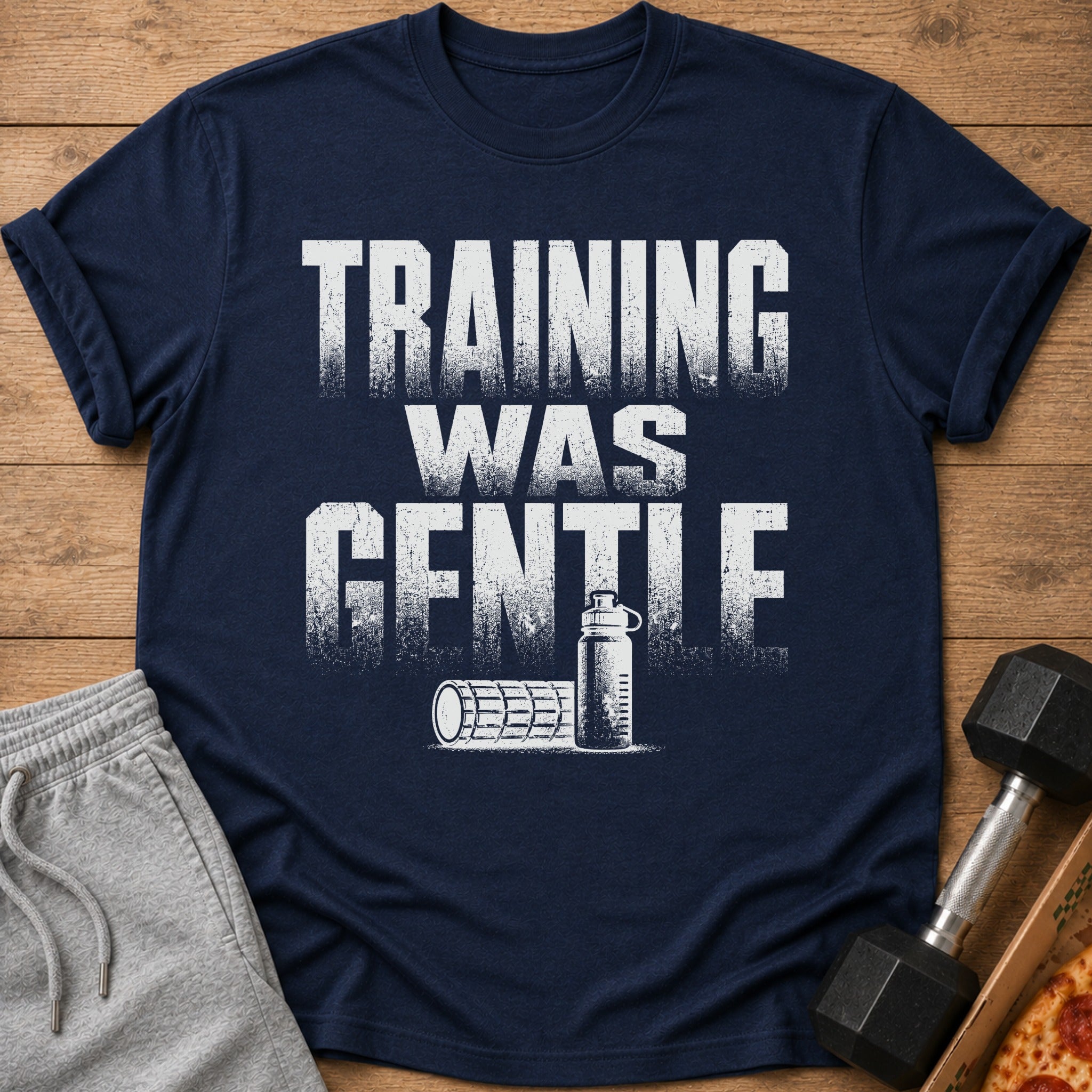Navy t-shirt with white distressed text "TRAINING WAS GENTLE" and gym icons.