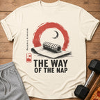 Cream t-shirt with graphic of a foam roller, moon, and text "THE WAY OF THE NAP".