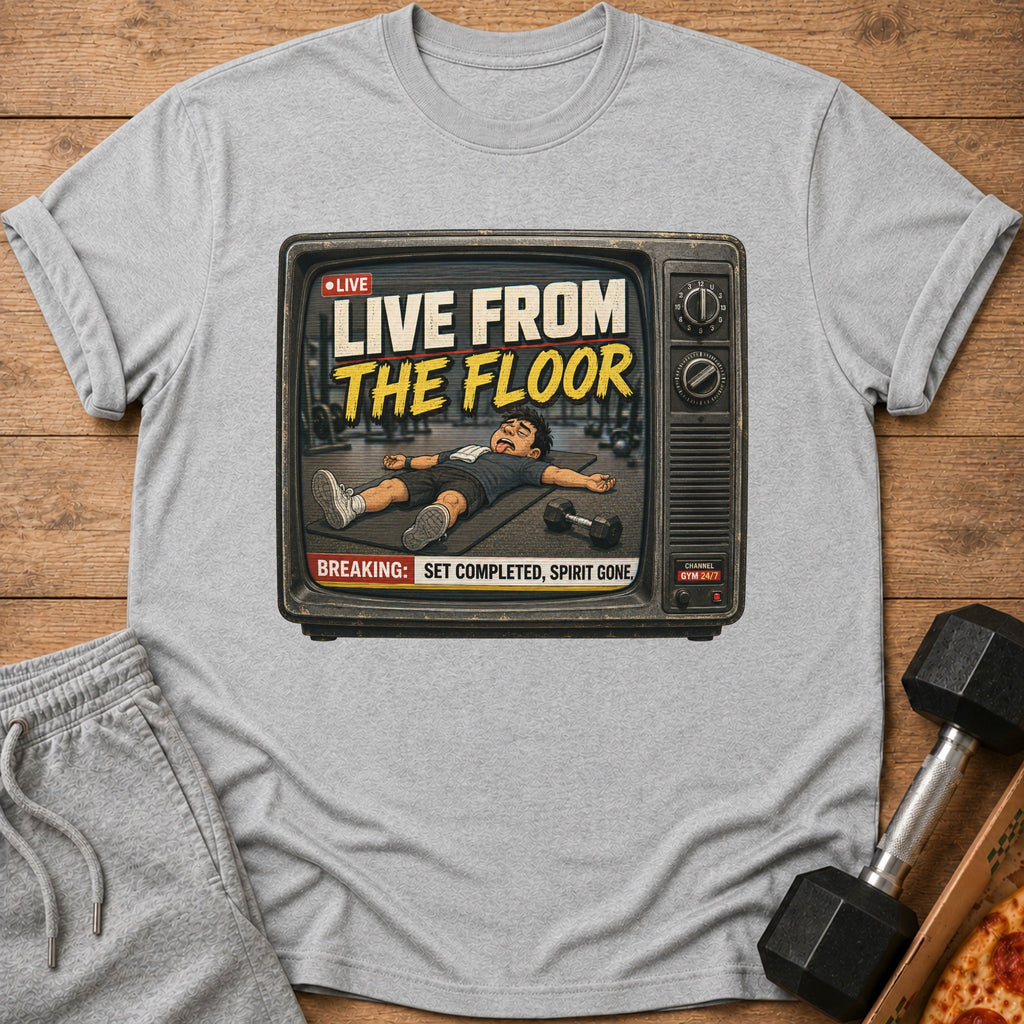 Gray t-shirt with graphic of a person collapsed on a mat inside a vintage TV screen.