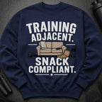 Navy sweatshirt with "Training Adjacent. Snack Compliant." text and illustrative icons.