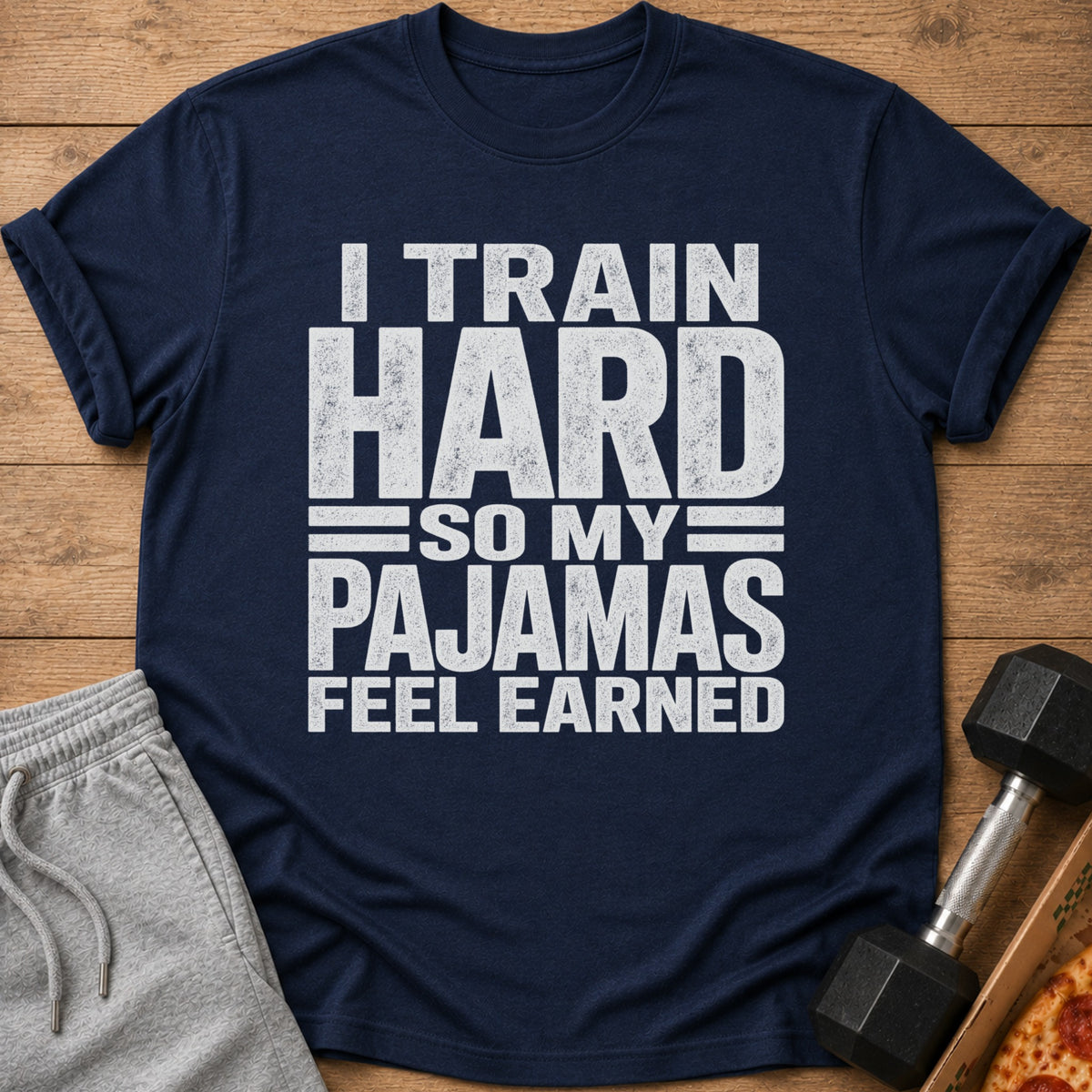 Navy t-shirt with "I TRAIN HARD SO MY PAJAMAS FEEL EARNED" text.