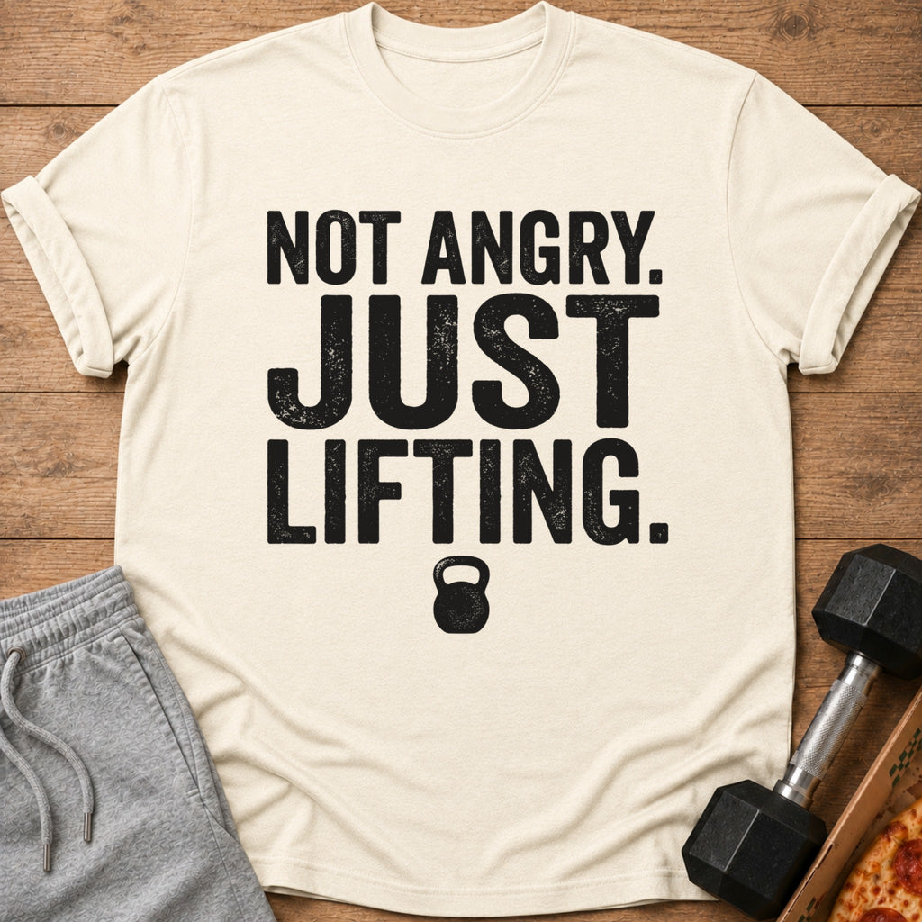 Cream t-shirt with text "NOT ANGRY. JUST LIFTING." and a kettlebell graphic.