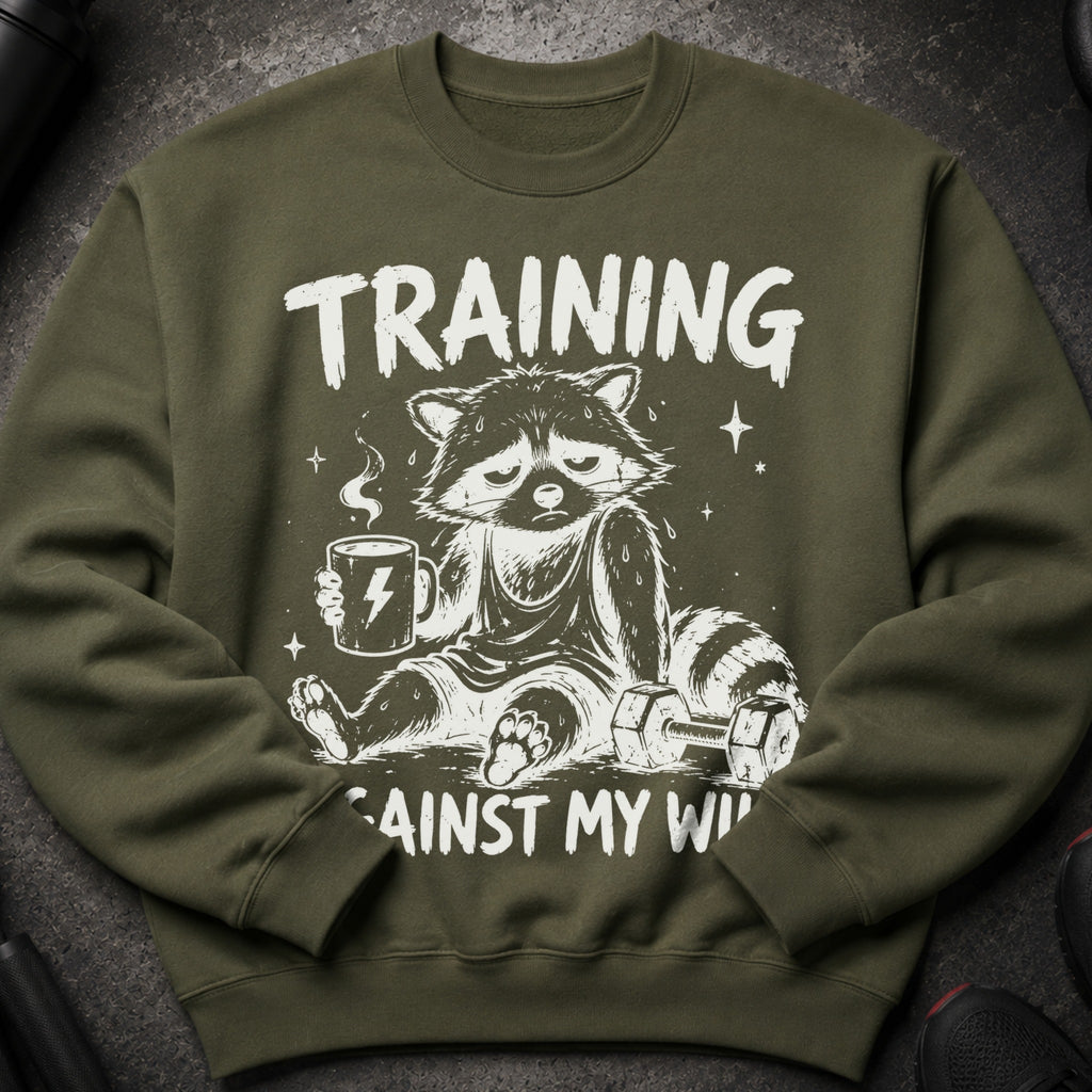 Green sweatshirt with raccoon, coffee, and dumbbells graphic: "TRAINING AGAINST MY WILL".