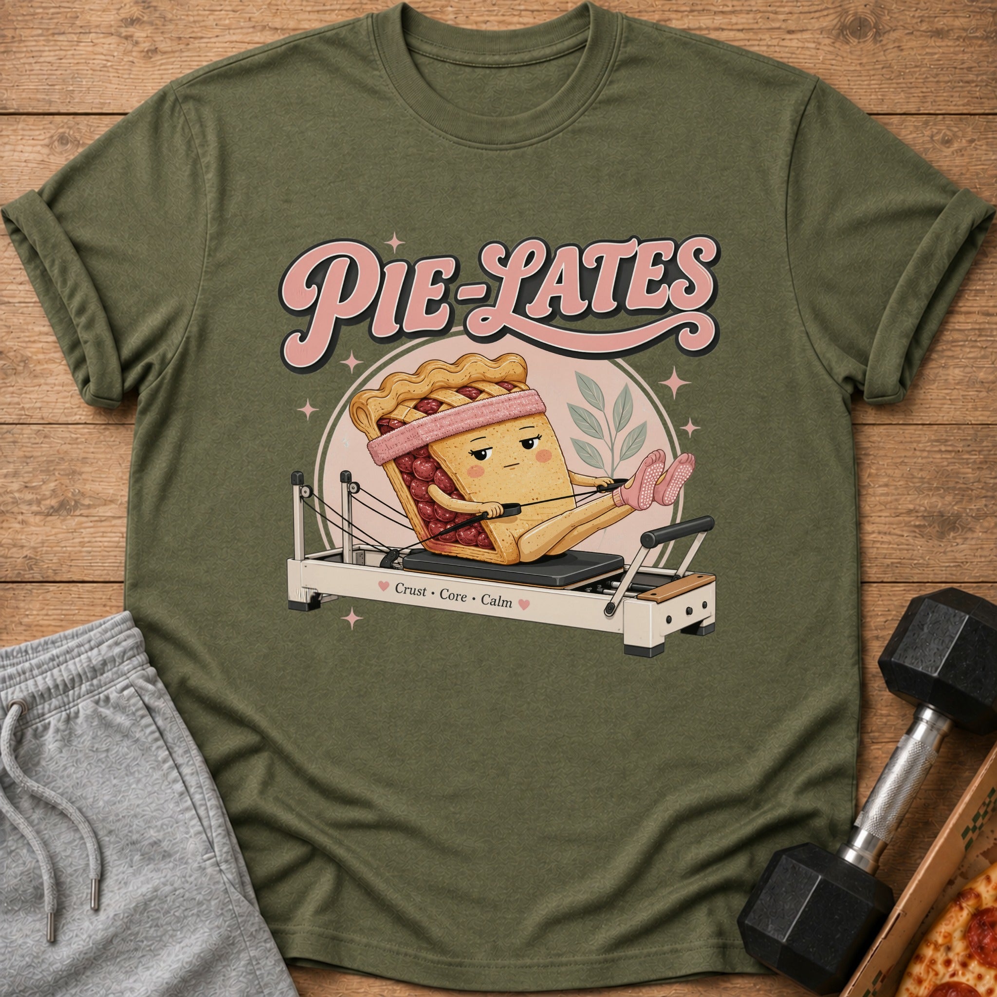Cherry pie slice with arms and legs doing Pilates on a reformer, text says "Pie-Lates".