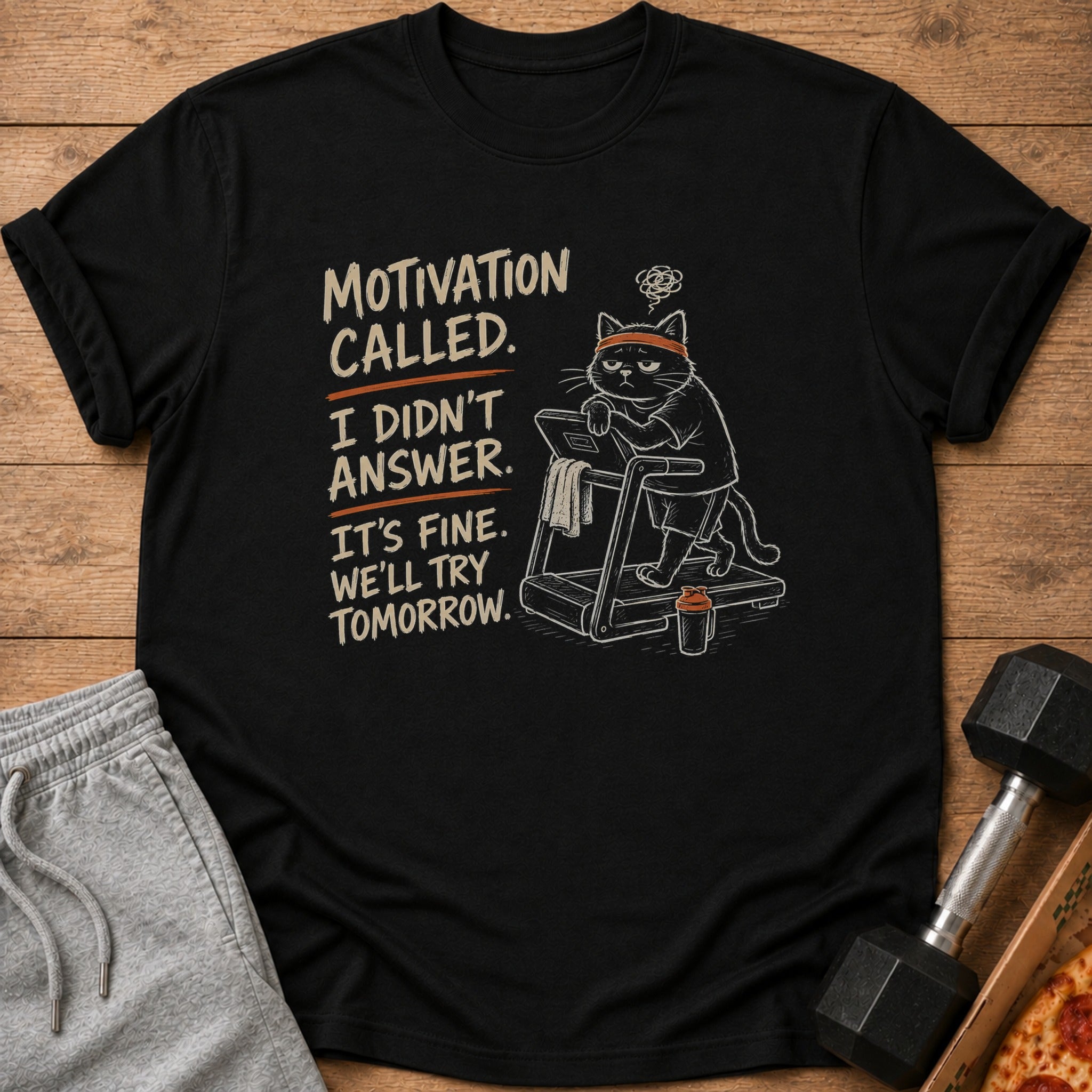 Black t-shirt with text and drawing of a cat on a treadmill.
