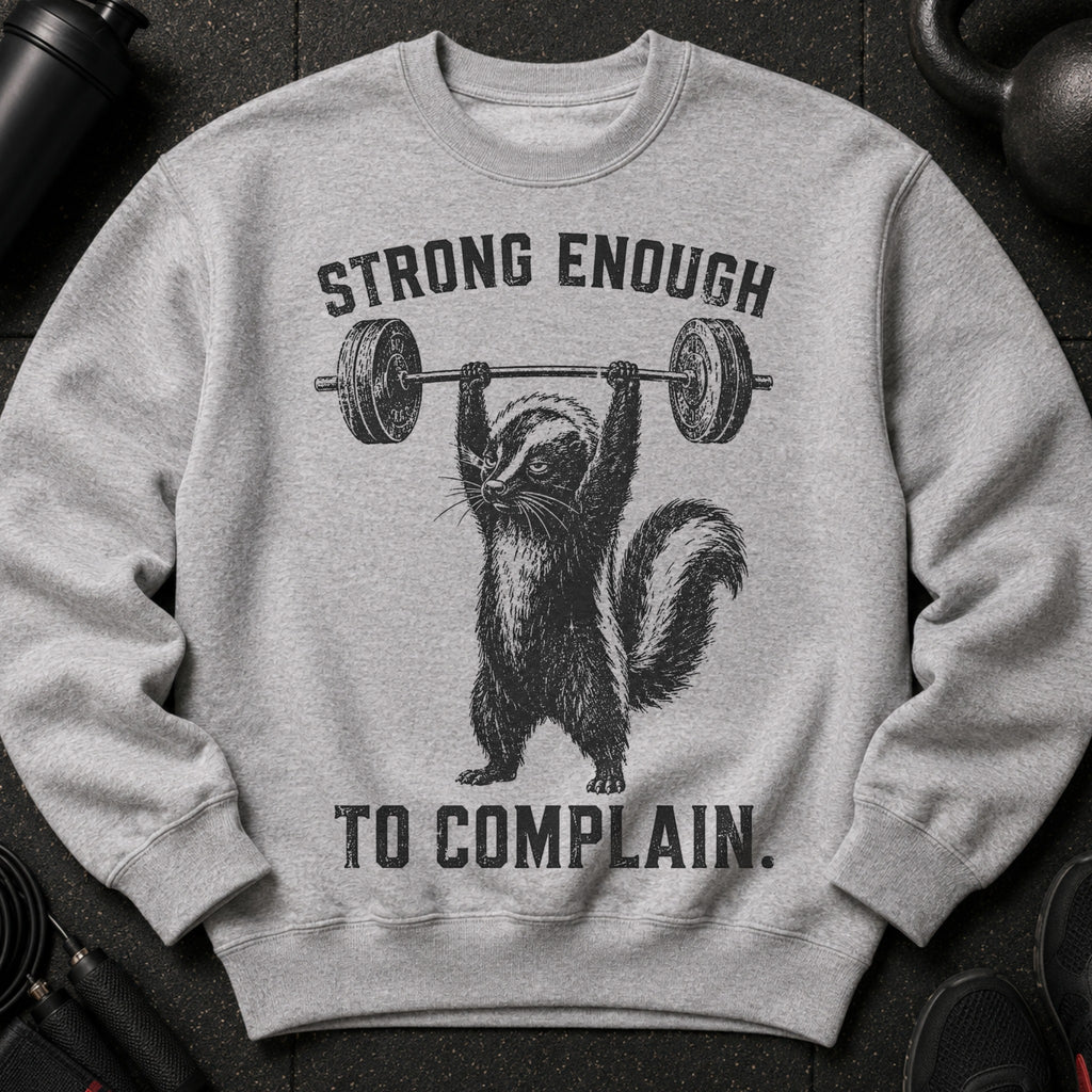 Grey sweatshirt with black graphic of skunk lifting barbell and text that says "STRONG ENOUGH TO COMPLAIN."