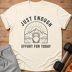 T-shirt with "JUST ENOUGH EFFORT FOR TODAY" text and kettlebell graphic.