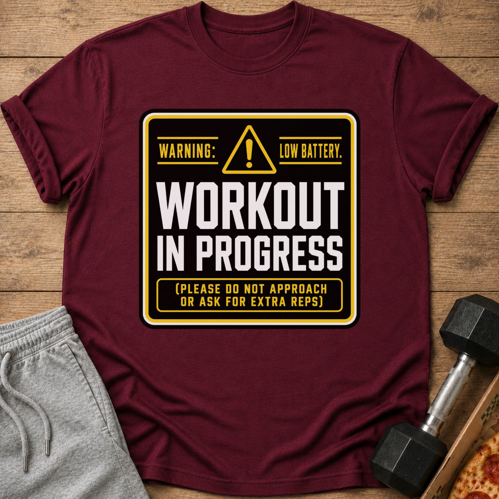Maroon t-shirt with "Workout In Progress" text and workout accessories.