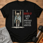 Black t-shirt with sloth hanging from bar, text reads "I showed up late but spiritually I never arrived."