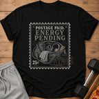 Black t-shirt with "Postage Paid, Energy Pending" stamp graphic including gym bag and 25 cents.