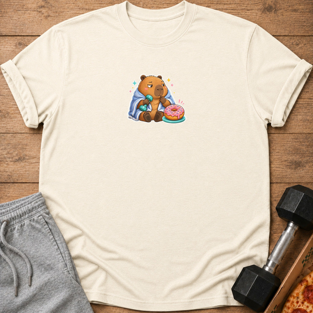 Capybara wearing blanket, holding dumbbell, with donut.