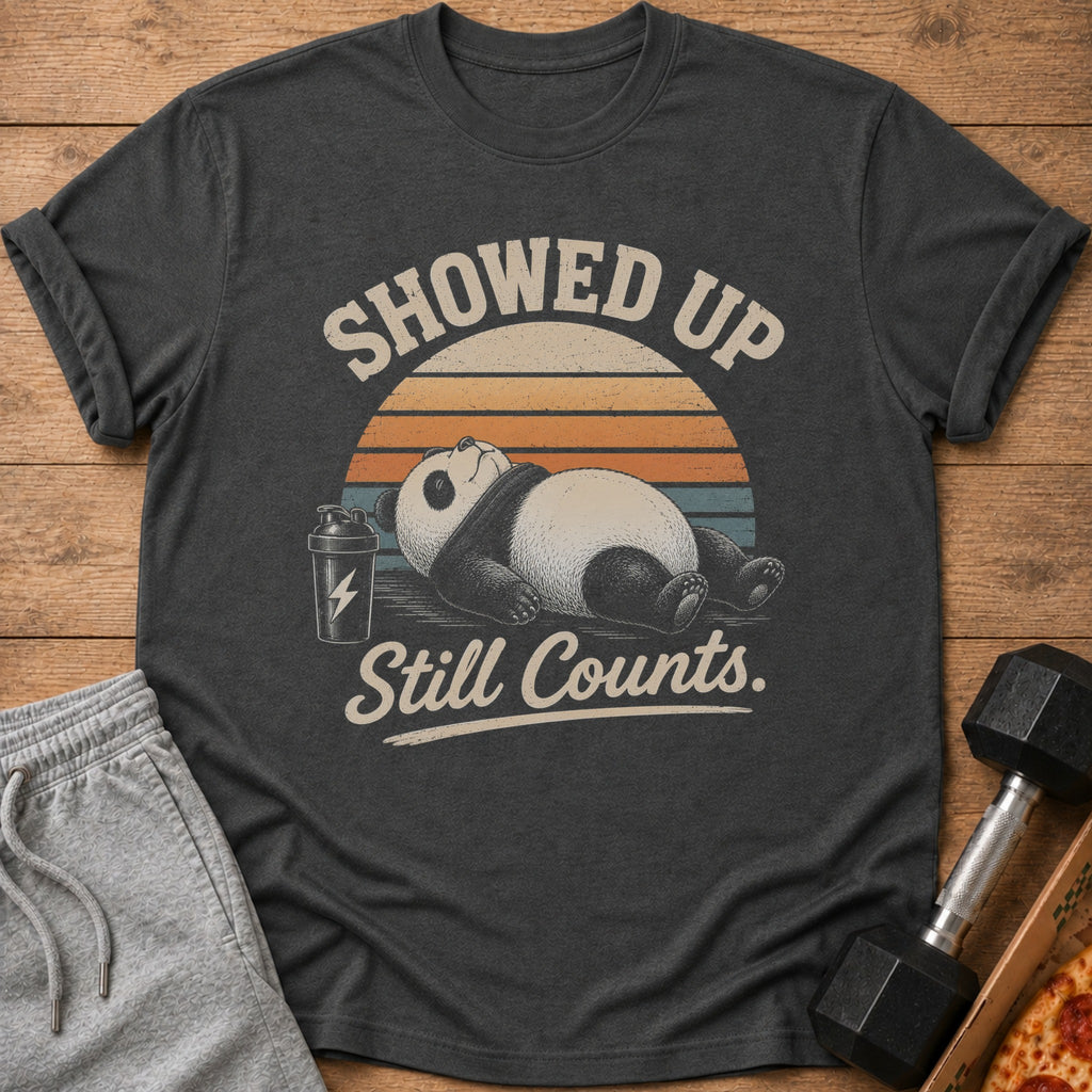 Dark grey t-shirt with a vintage graphic of a panda and text reading "Showed Up Still Counts."