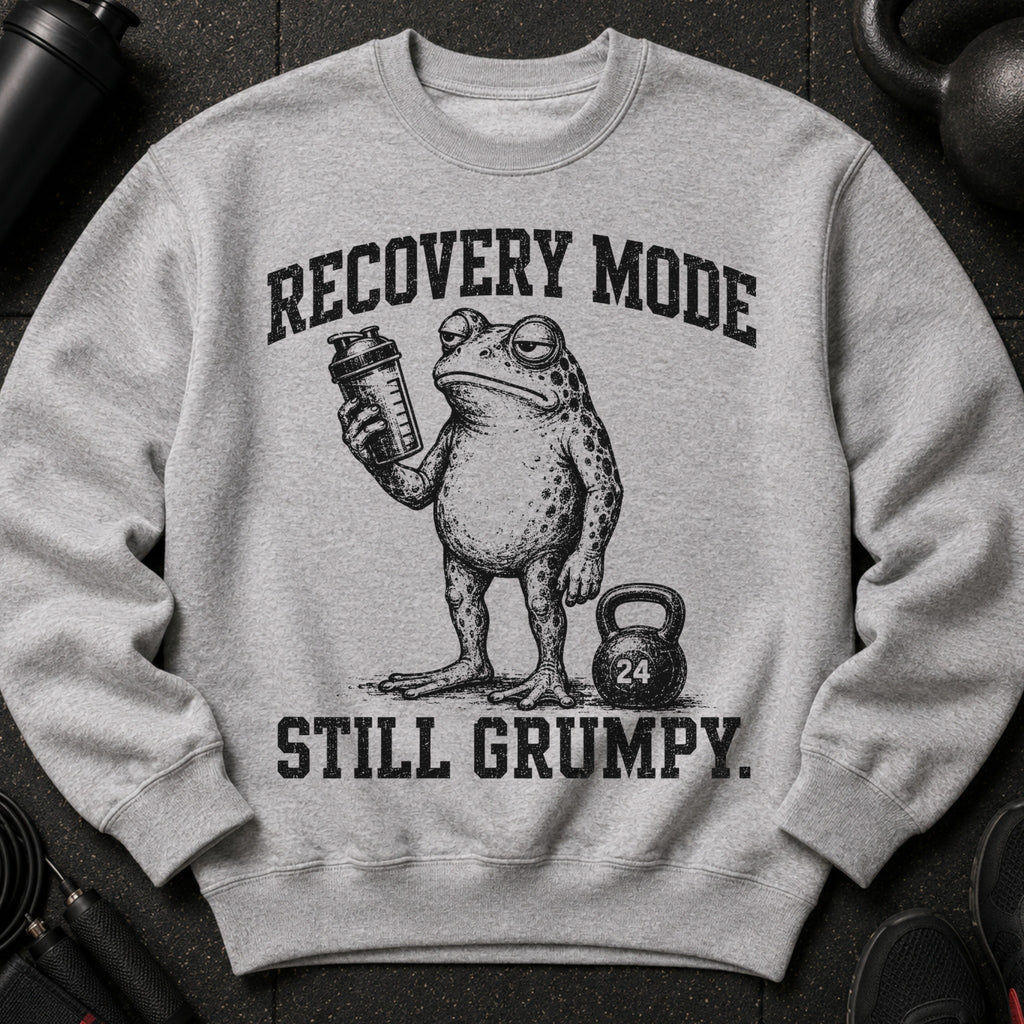 Grey crewneck sweatshirt with a grumpy frog holding a shaker and text "Recovery Mode Still Grumpy".