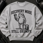 Grey crewneck sweatshirt with a grumpy frog holding a shaker and text "Recovery Mode Still Grumpy".