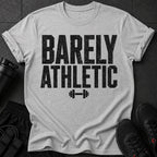 Gray t-shirt with "BARELY ATHLETIC" text and barbell graphic.
