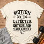 Light t-shirt with black text: MOTION DETECTED. ENTHUSIASM NOT FOUND.