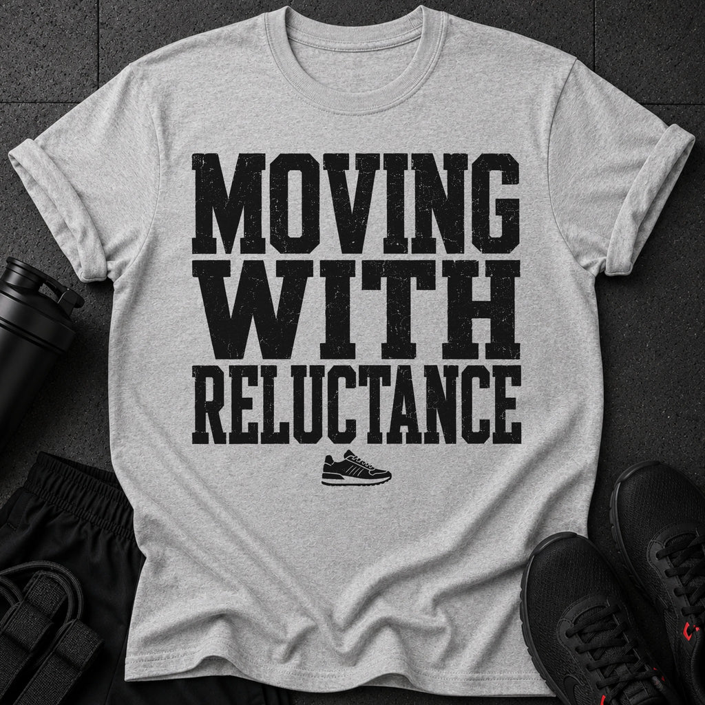 Grey t-shirt with black distressed text "MOVING WITH RELUCTANCE" and a sneaker graphic.