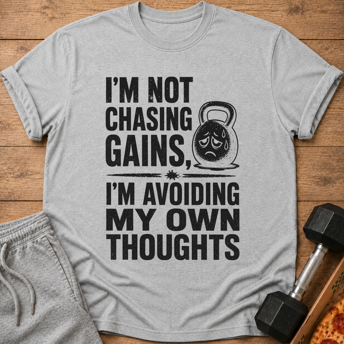 Grey t-shirt with text "I'm not chasing gains, I'm avoiding my own thoughts."