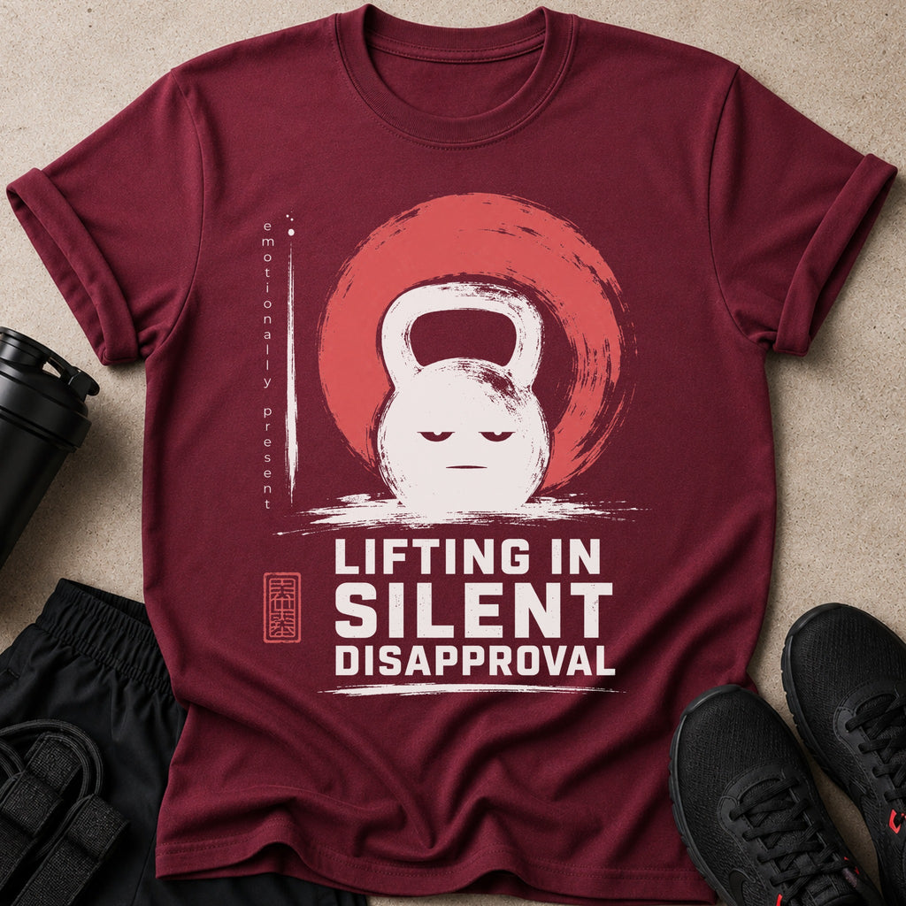 Maroon t-shirt with a white kettlebell graphic and text "LIFTING IN SILENT DISAPPROVAL".