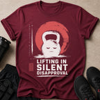 Maroon t-shirt with a white kettlebell graphic and text "LIFTING IN SILENT DISAPPROVAL".