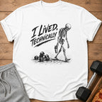 White t-shirt with "I Lived, Technically" text and skeleton walking past dumbbells.