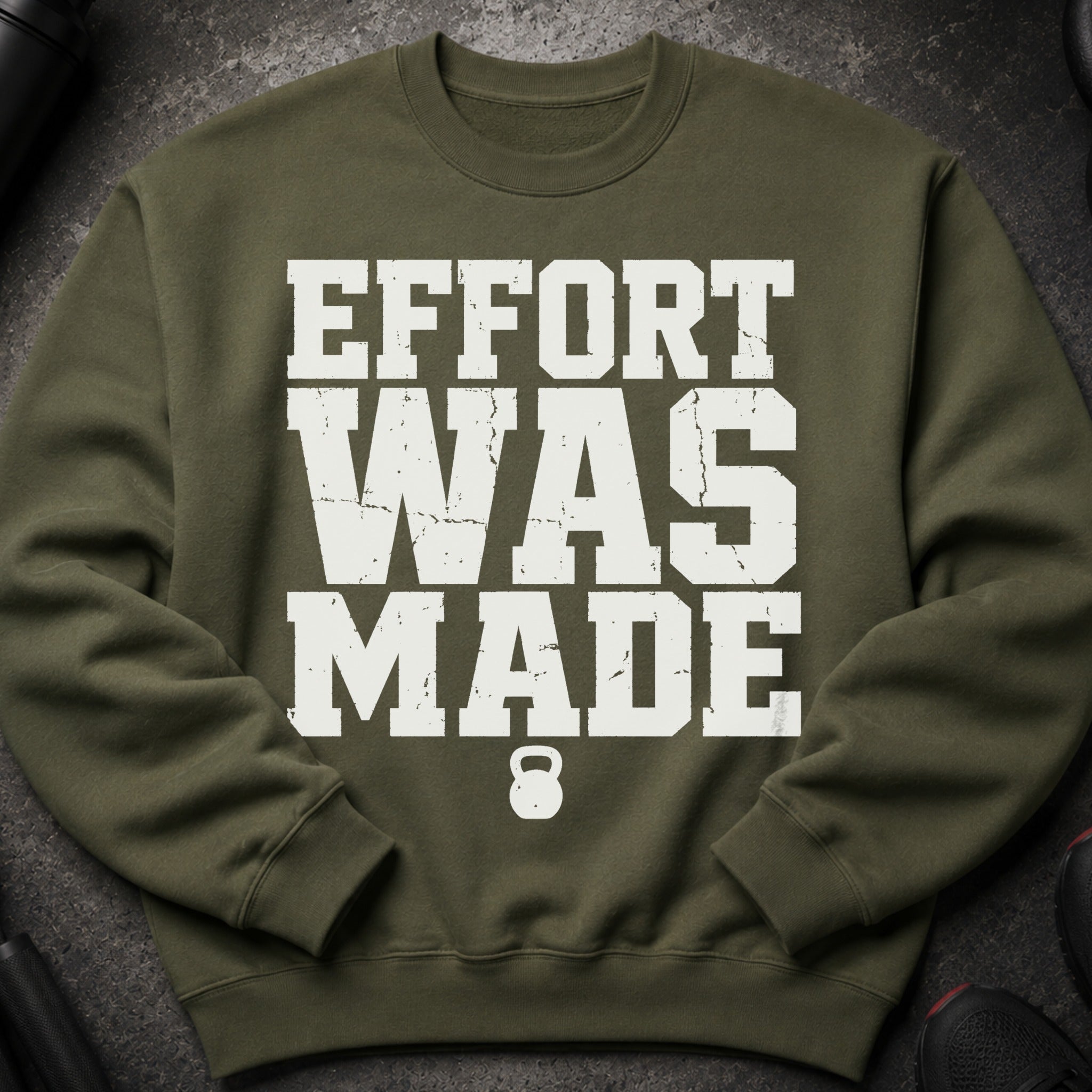 Olive green sweatshirt with "EFFORT WAS MADE" and a kettlebell graphic.