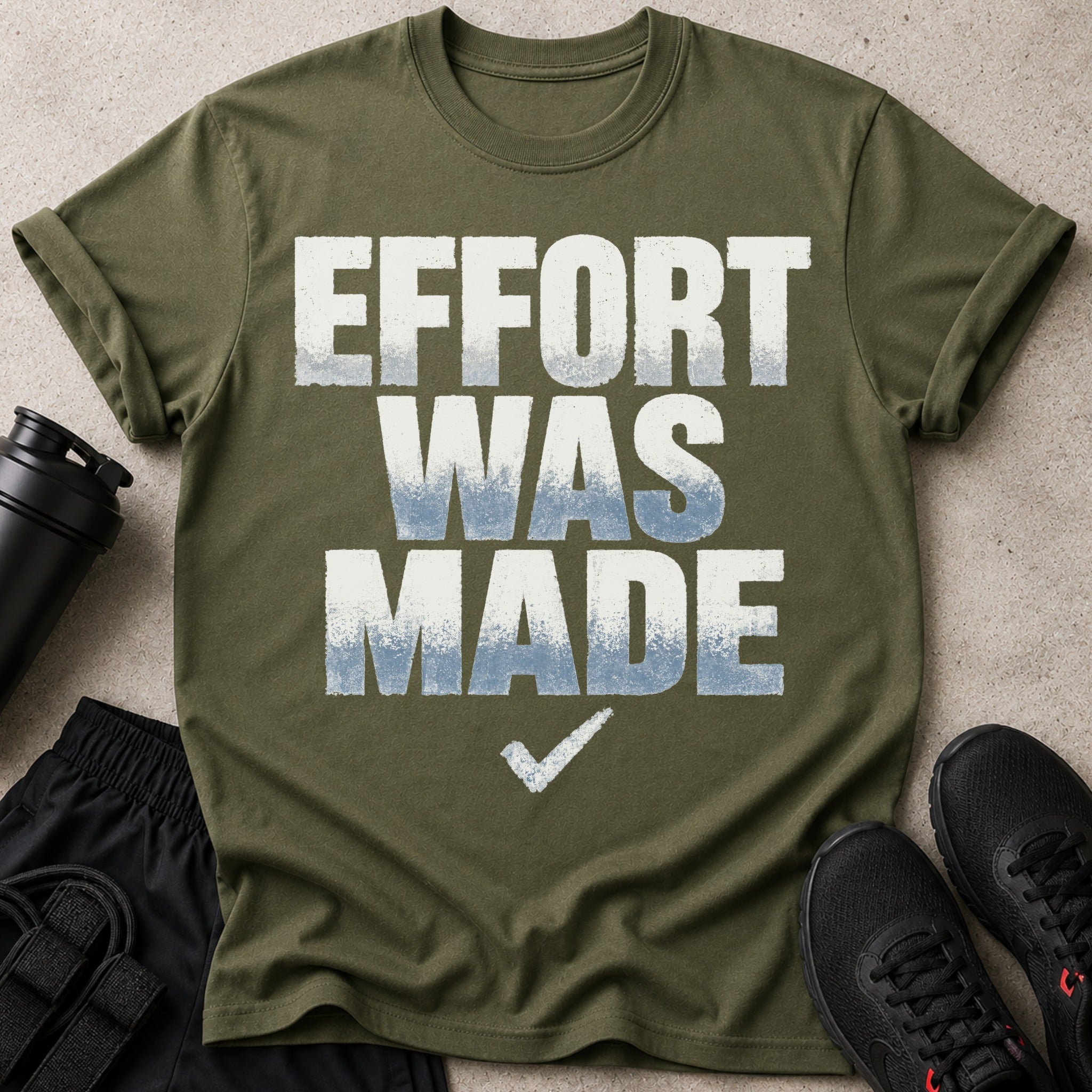 Olive green t-shirt with "EFFORT WAS MADE" text and a checkmark.