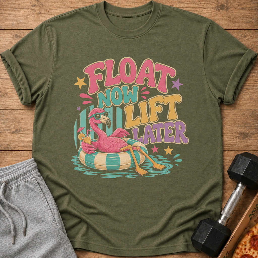 Green t-shirt with flamingo on float, text "FLOAT NOW LIFT LATER".
