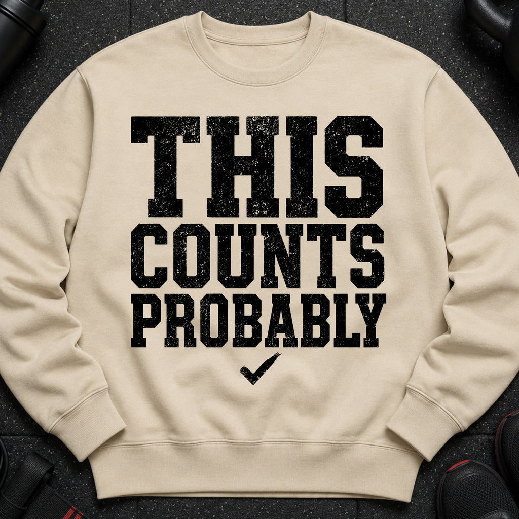 Beige crewneck sweatshirt with black distressed text reading "THIS COUNTS PROBABLY" and a checkmark.