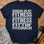 Navy t-shirt with text: "Working on my fitness and by fitness I mean fittin' back on the couch."
