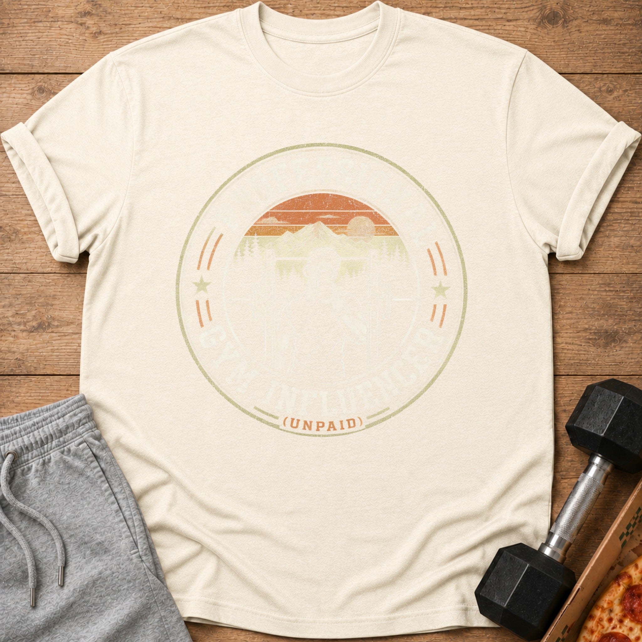 Cream t-shirt with "Gym Influencer (Unpaid)" graphic featuring mountains and sun.