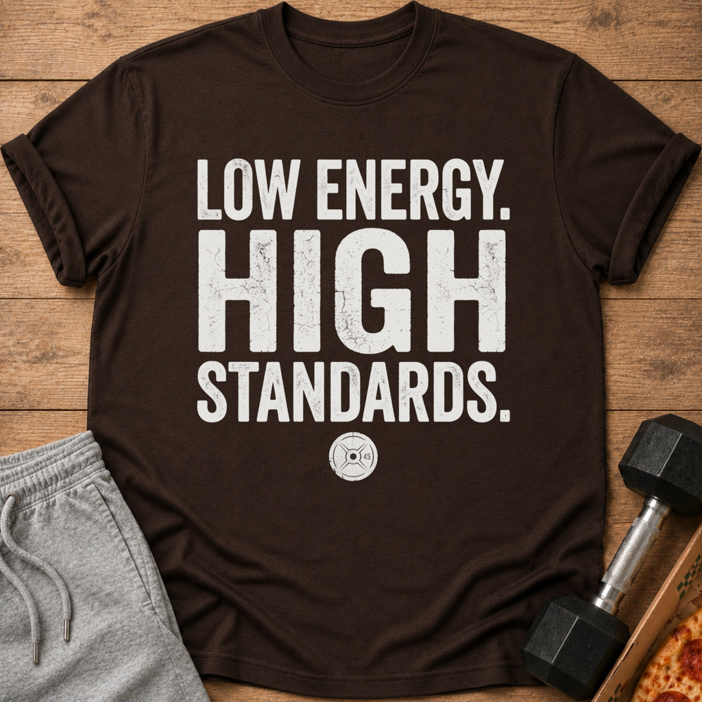 Brown t-shirt with white text "LOW ENERGY. HIGH STANDARDS." and weight plate graphic.