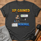 T-shirt design with "XP GAINED" in pixelated font and workout-themed graphics.