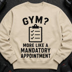 Cream sweatshirt with "GYM? MORE LIKE A MANDATORY APPOINTMENT" graphic and clipboard icon.