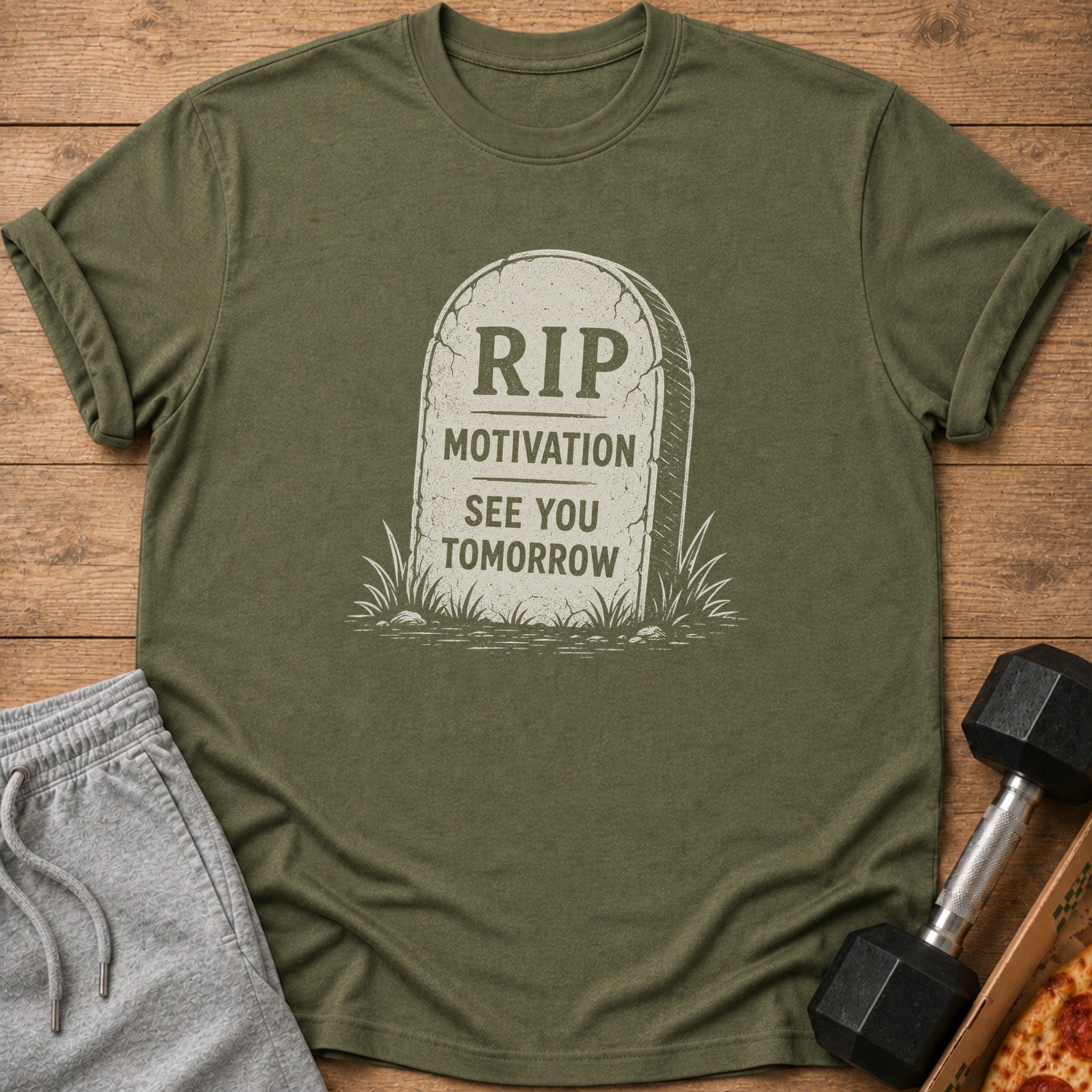 Olive green t-shirt with tombstone graphic saying "RIP MOTIVATION SEE YOU TOMORROW."